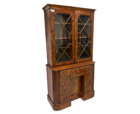 19th century figured walnut bookcase on cabinet, two astragal glazed doors with surrounding feather stringing enclosing three