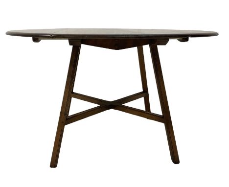 Ercol - mid-20th century elm and beech 'Old Colonial' model 377 dining table, circular top with double drop-leaf top, on spla