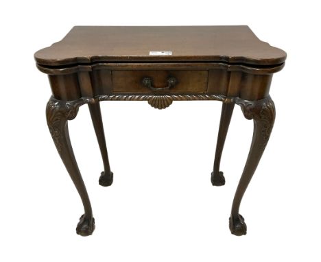 George II design mahogany card or games table, the shaped hinged top with stepped circular eared corners, revealing sunken co