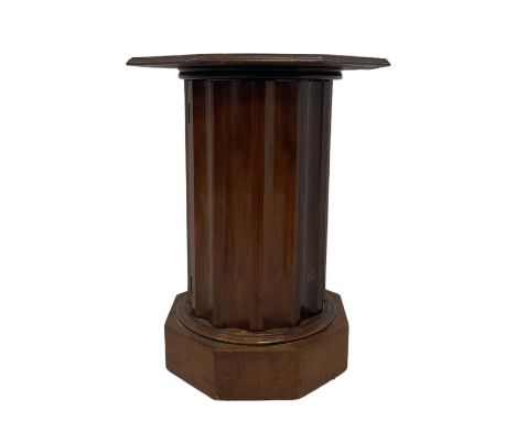 Unusual 19th century walnut pot cupboard, octagonal top with moulded edge, the concave faceted pedestal fitted with single cu