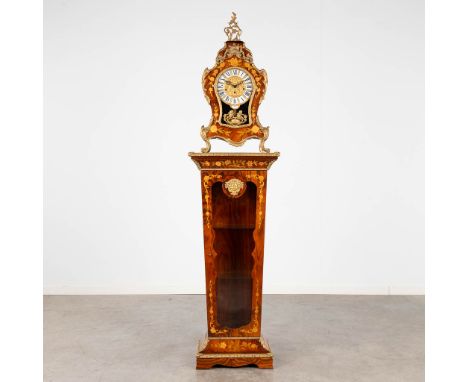 A Cartel. clock on a matching pedestal, marquetry inlay and mounted with bronze.20th century.&nbsp;Dimensions:(D:25 x W:48 x 