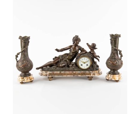 A three-piece garniture clock and side pieces, decorated of a lady with an angel, spelter on marble.Central figures signed 'C