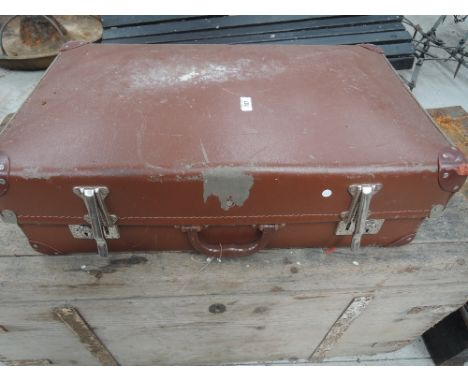 A vintage composite suitcase