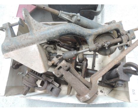 A box of miscellaneous vintage hand tools and vices