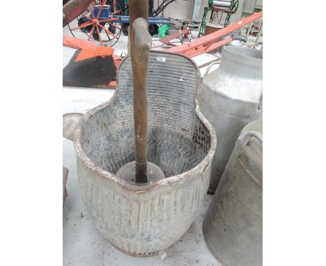 A vintage galvanised wash tub of unusual form with soap dish and poss stick