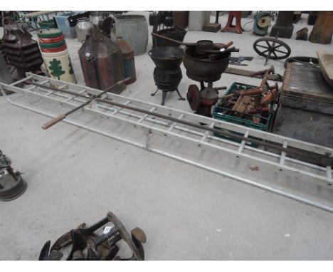An aluminium ladder with hand rails