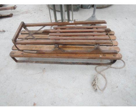 Two vintage wooden sledges
