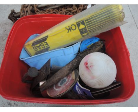 A box containing miscellaneous tools and fittings