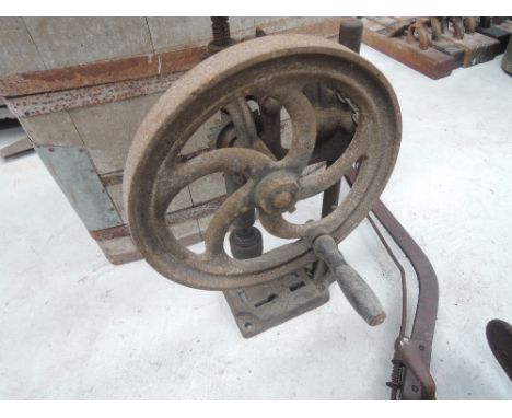 A vintage hand cranked bench drill