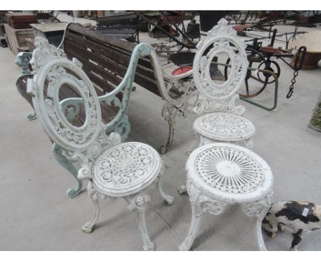 Two painted metal garden chairs and table