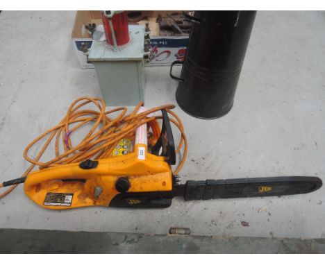 A JCB electric chainsaw