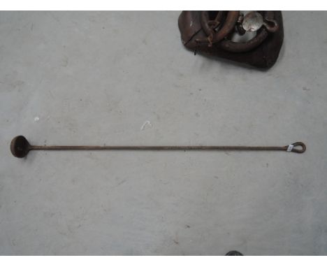A long handled ladle