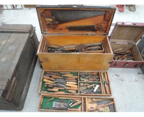 A vintage carpenters tool box and contents