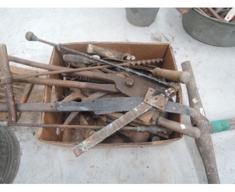 A box of vintage hand tools