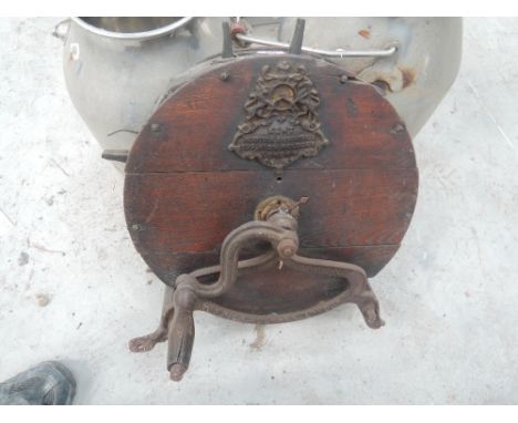 A vintage hand cranked knife sharpener