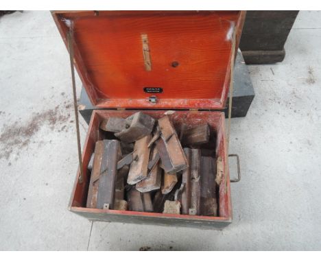 A vintage box containing a selection of moulding planes