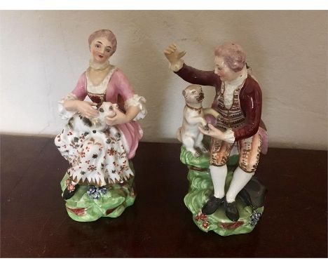 Pair Derby patch mark figures Nos. 51 & 127 Lady and gent with cat and pug