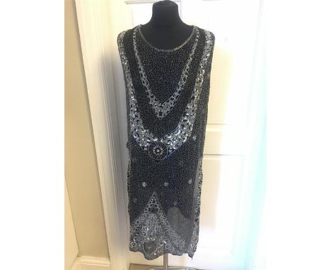 A 1920's beaded cocktail dress slight damage to beads at hem