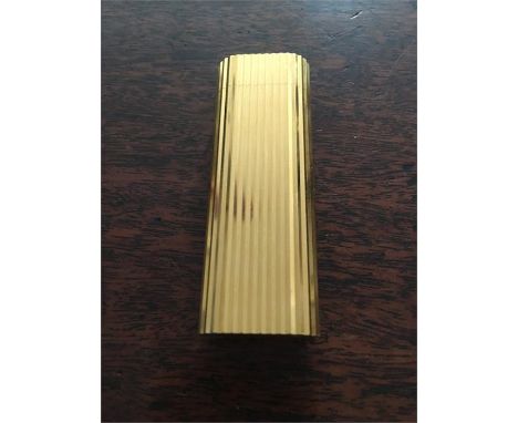 Cartier gilt metal cigarette lighter c1980 7 x 2.5 cms