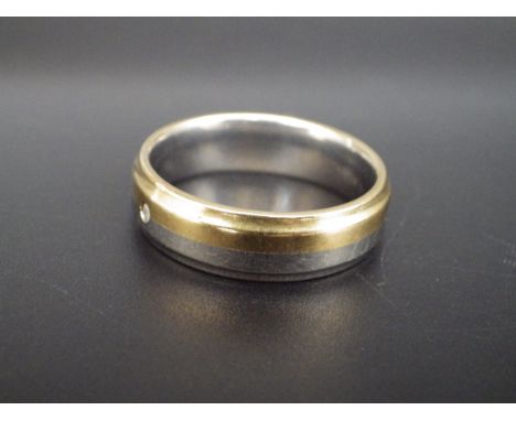 &nbsp;A boxed 9ct gold and Titanium band ring size X/Z 5.19g total lot weight.