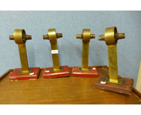 A set of four brass double lamp bases 