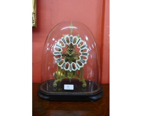 A 19th Century brass skeleton clock with glass dome on painted base 