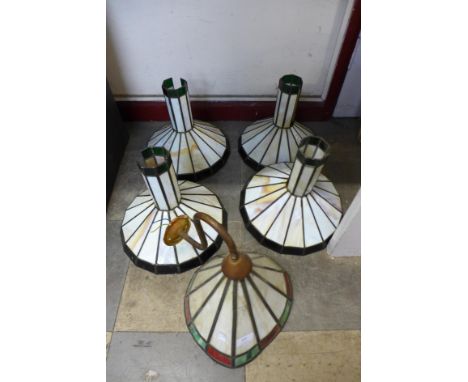 A set of four stained glass shades and a wall light 