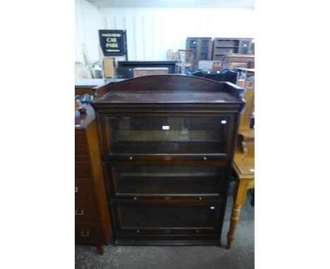 An early 20th Century Lebus mahogany four tier sectional stacking bookcase 