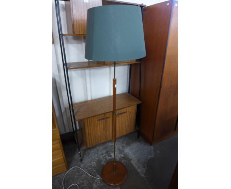 A teak standard lamp 