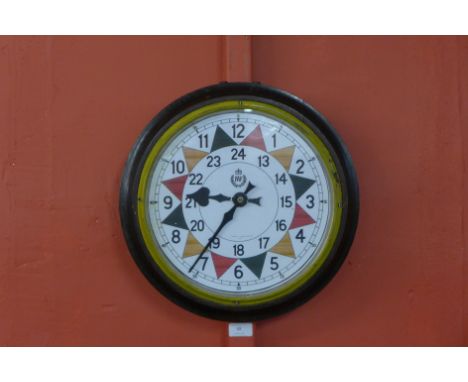 An early 20th Century electric circular wall clock, bearing R.A.F. insignia to the dial 