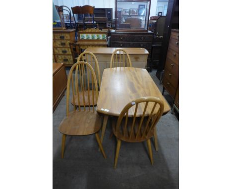 An Ercol blonde drop-leaf table and four chairs 