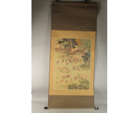 A FINE CHINESE SCROLL PAINTING ON SILK DEPICTING MULTIPLE BOYS PLAYING IN A GARDEN, inscribed lower left with red seal mark, 