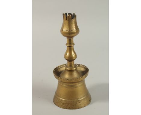 A 17TH CENTURY OTTOMAN TURKISH BRASS TULIP SHAPE CANDLESTICK, 24cm high.