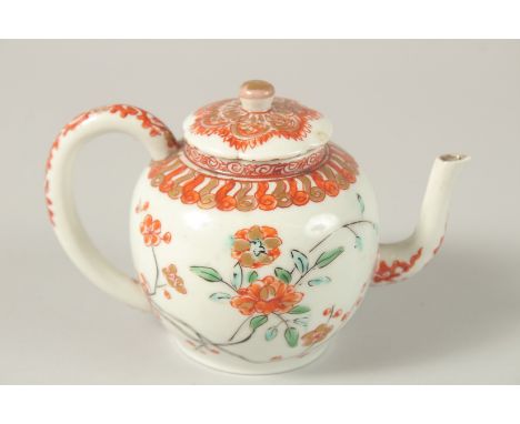 A 17TH CENTURY CHINESE COPPER RED AND WHITE PORCELAIN MINIATURE TEAPOT, painted with flora and gilded motifs, 8cm high.