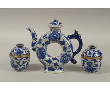 A CHINESE BLUE AND WHITE PORCELAIN PIERCED CENTRE TEAPOT, together with associated pair of lidded pots, each with six-charact