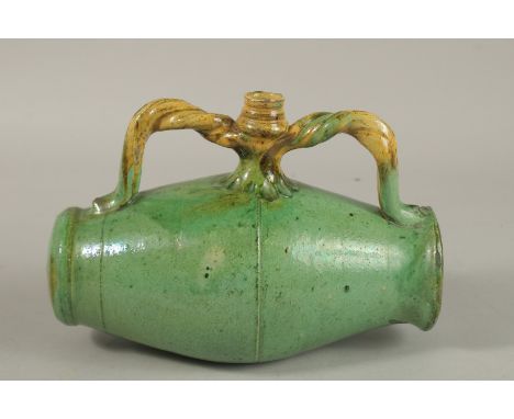 A RARE 19TH CENTURY POSSIBLY OTTOMAN TURKISH CANAKKALE GLAZED POTTERY BARREL SHAPED FLASK, 24cm wide.