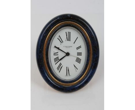 Cartier travelling alarm clock with white oval dial, Roman numerals and subsidiary alarm hand, signed - Cartier Paris, in an 