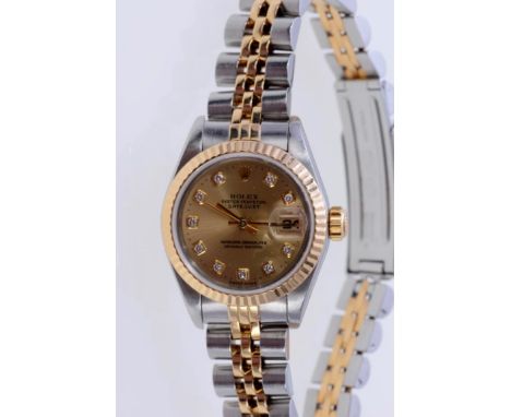 Ladies' Rolex Oyster Perpetual Date Just wristwatch, model no. 69173, with gold satin finish dial and diamond set hour marker