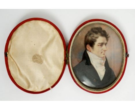 Georgian oval portrait miniature on ivory - a gentleman in black coat, in original silk-lined red leather covered folding cas