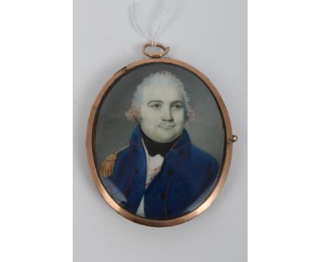 Georgian oval portrait miniature on ivory - an Officer, in oval yellow metal frame with blue guilloche enamel band surroundin