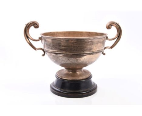 George V silver two-handled bowl of circular form, with open scroll handles and engraved presentation inscription, on circula