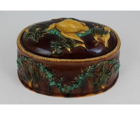 Victorian Majolica oval game dish with liner, the cover and sides moulded with dead game and swags and grapes, 34cm CONDITION