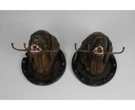 Pair of early 20th century Continental painted plaster figural whip racks, each modelled as the head of a gun dog within hors