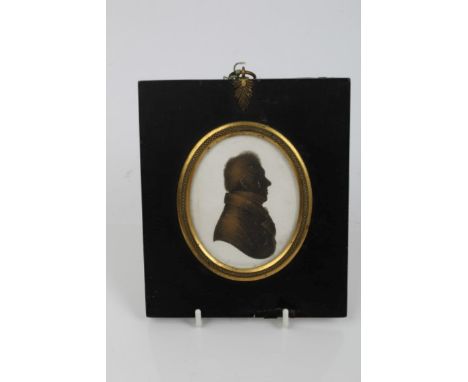 Regency oval portrait silhouette - profile of a gentleman, on oval plaster panel, in gilt metal mounted ebonised frame, 8.5cm