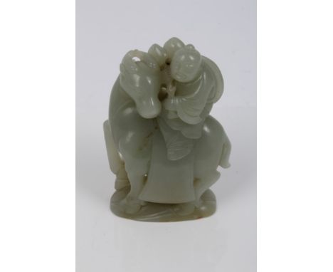 Chinese pale jade / green hardstone figure of a stout gentleman riding an ox, the figure in trailing robes holding a peach br