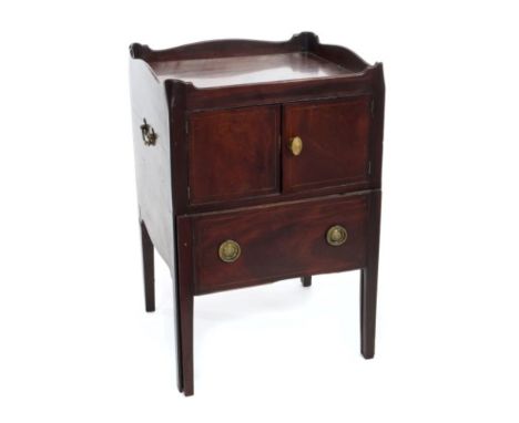 George III mahogany bedside cabinet with shaped gallery, enclosed by cupboard doors with sliding pot drawer below, flanked by