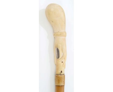 Interesting 19th century walking cane with ivory handle carved as a lady's hand and wrist, with white metal plaque inscribed 