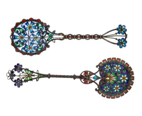 Two Continental white metal and plique-à-jour enamel spoons with twist stems and ornate floral bowls, possibly Scandinavian o