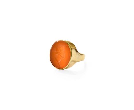 A Carnelian Intaglio Ring, the oval carnelian in a yellow rubbed over setting, to a plain polished shank, finger size KUnmark