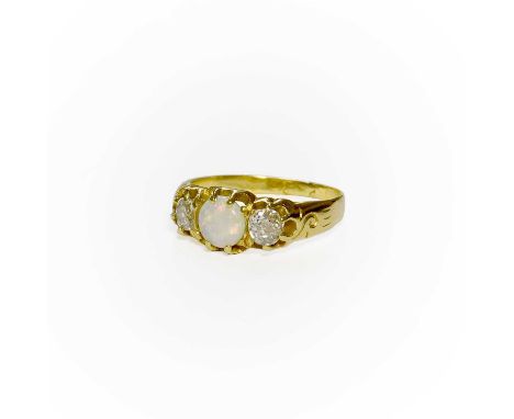 An Opal and Diamond Three Stone Ring, the round cabochon opal flanked by old cut diamonds, in yellow claw settings, to a scro